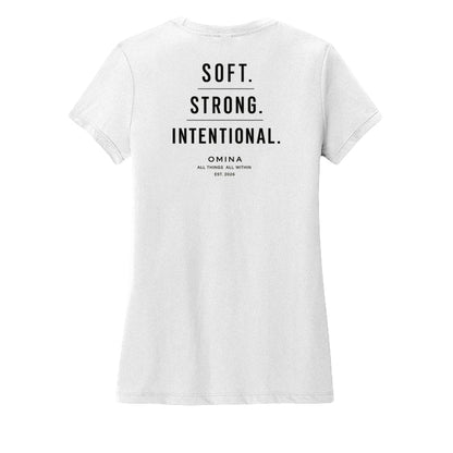 Omina white cotton t-shirt with black text reading SOFT. STRONG. INTENTIONAL. OMINA ALL THINGS ALL WITHIN EST. 2026.