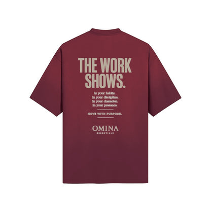 Omina burgundy cotton t-shirt with "THE WORK SHOWS." graphic print on back.