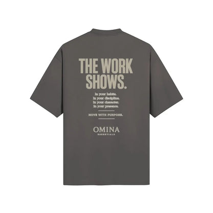 Omina grey cotton t-shirt with "THE WORK SHOWS." graphic print on back.