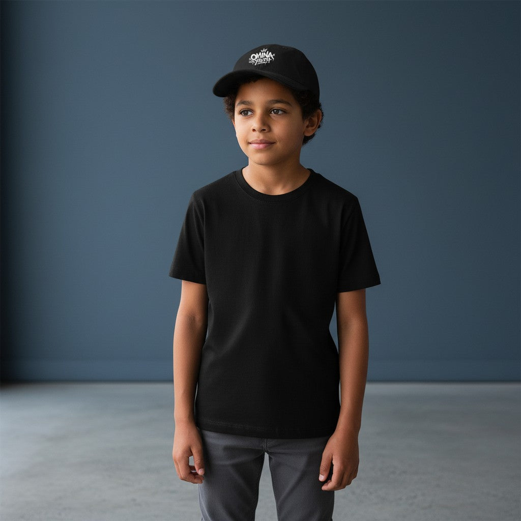 Omina Youth black cotton twill low-profile cap with white graffiti-style logo and adjustable buckle closure.