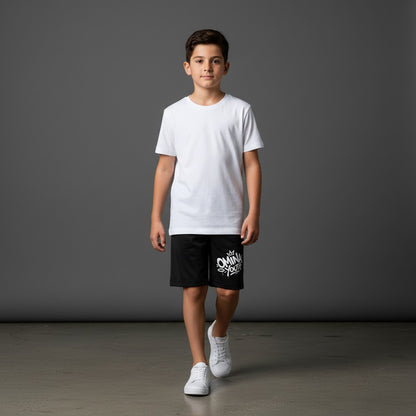 Omina Youth black relaxed fit shorts with white graffiti-style logo on the left leg. Elastic waistband.