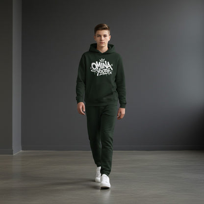 A boy wearing an Omina dark green fleece hoodie with white graffiti-style chest graphic and matching joggers.
