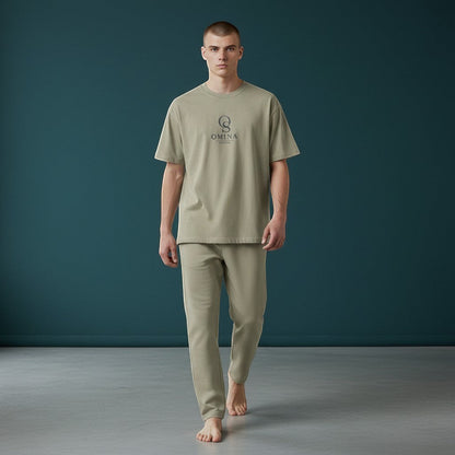 Omina Studio men's relaxed fit light olive cotton t-shirt and matching trousers set with subtle logo.