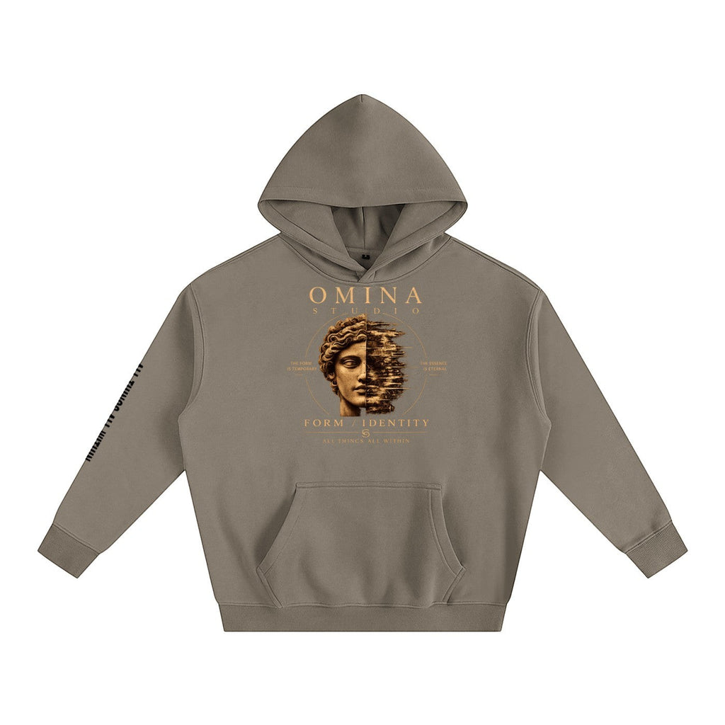 Omina Studio taupe oversized fleeced hoodie with a graphic print of a split face and text.