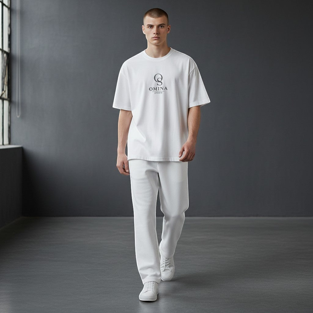Omina Studio white relaxed fit cotton t-shirt and matching trousers set on a male model.