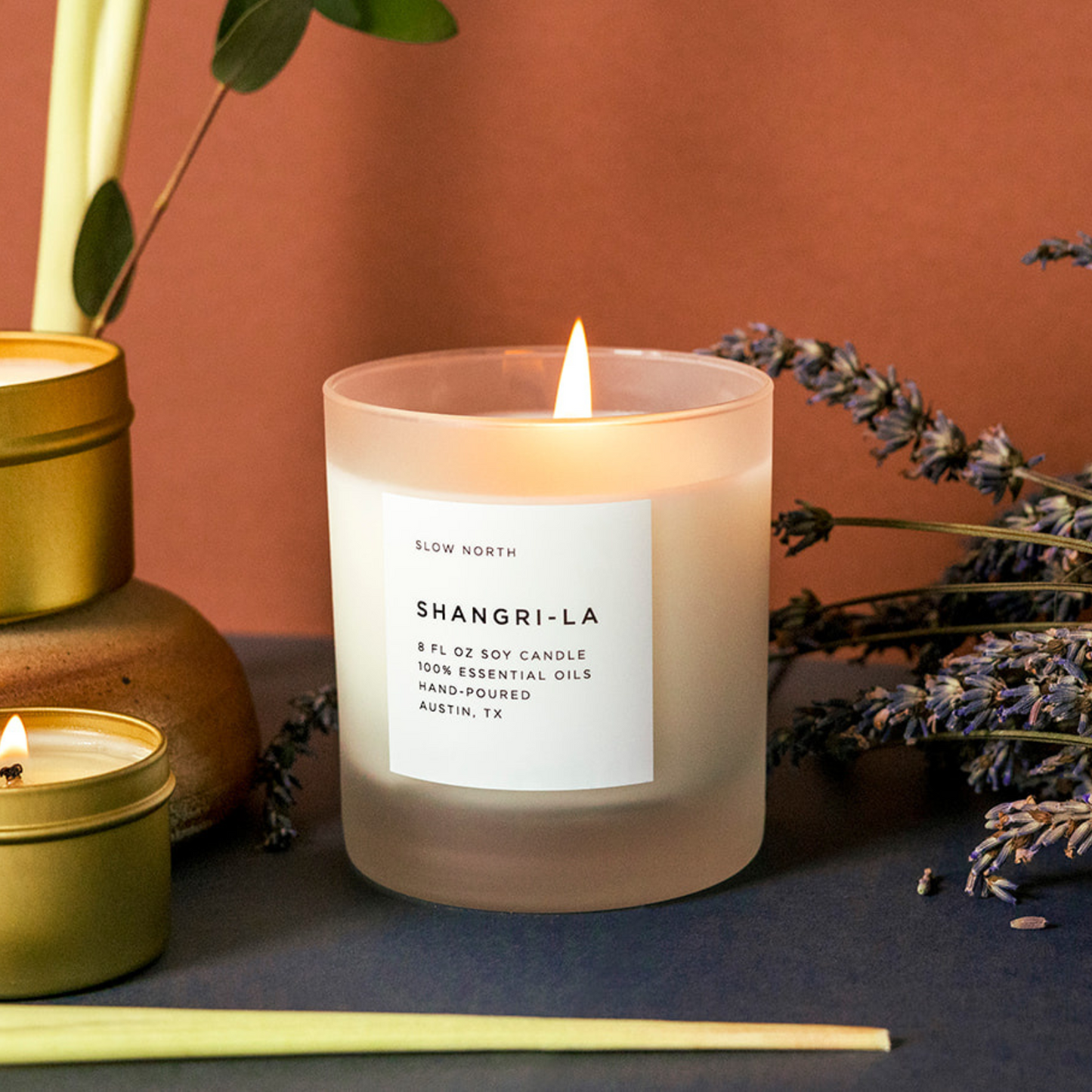 Frosted Shangri-La Signature Candle by Slow North with eucalyptus, lavender, and lemongrass scents in an 8oz glass jar